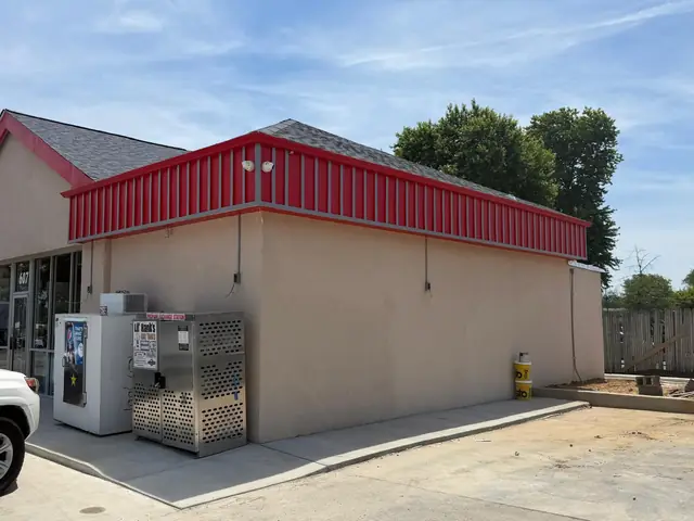 Side wall of the store with propane cage and ice merchandiser