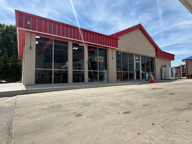 Front of the store in daylight with new sidewalk