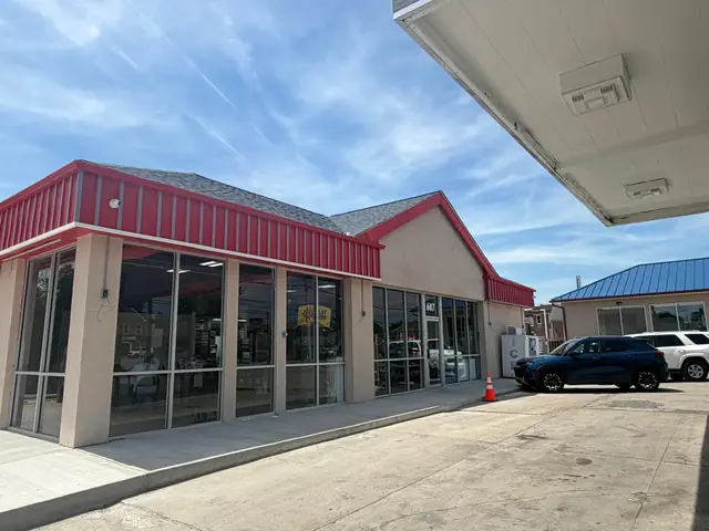 New roof, stucco walls and metal fascia on a finished building