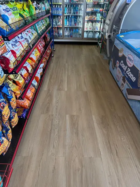 Finished store interior with new plank flooring and stocked shelving