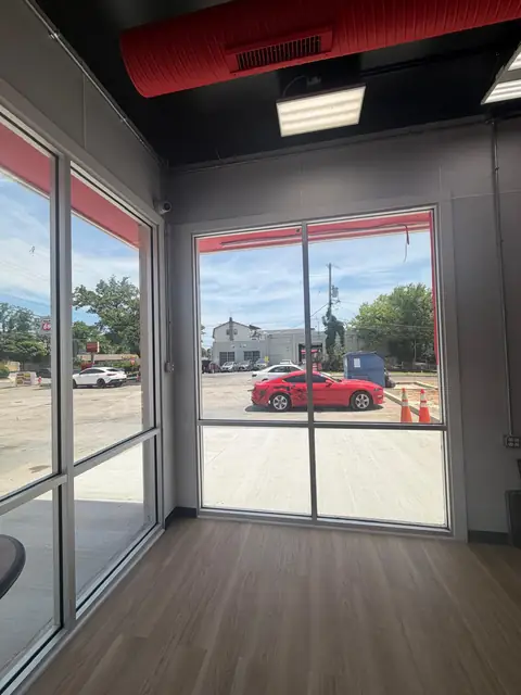 Glass corner of the seating area with new flooring and ceiling