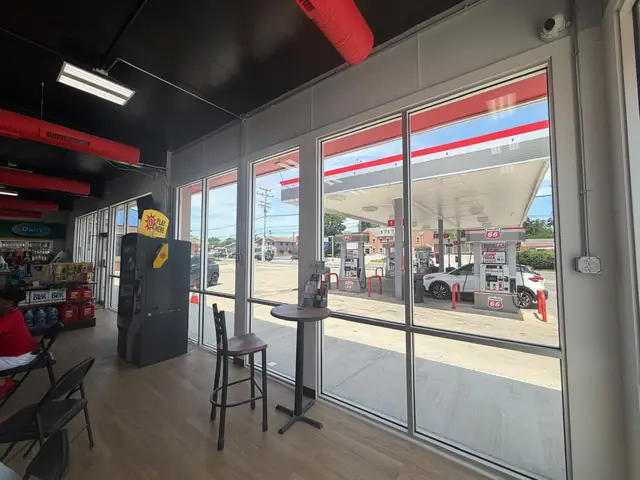 Interior seating area with ATM and view of the sales floor
